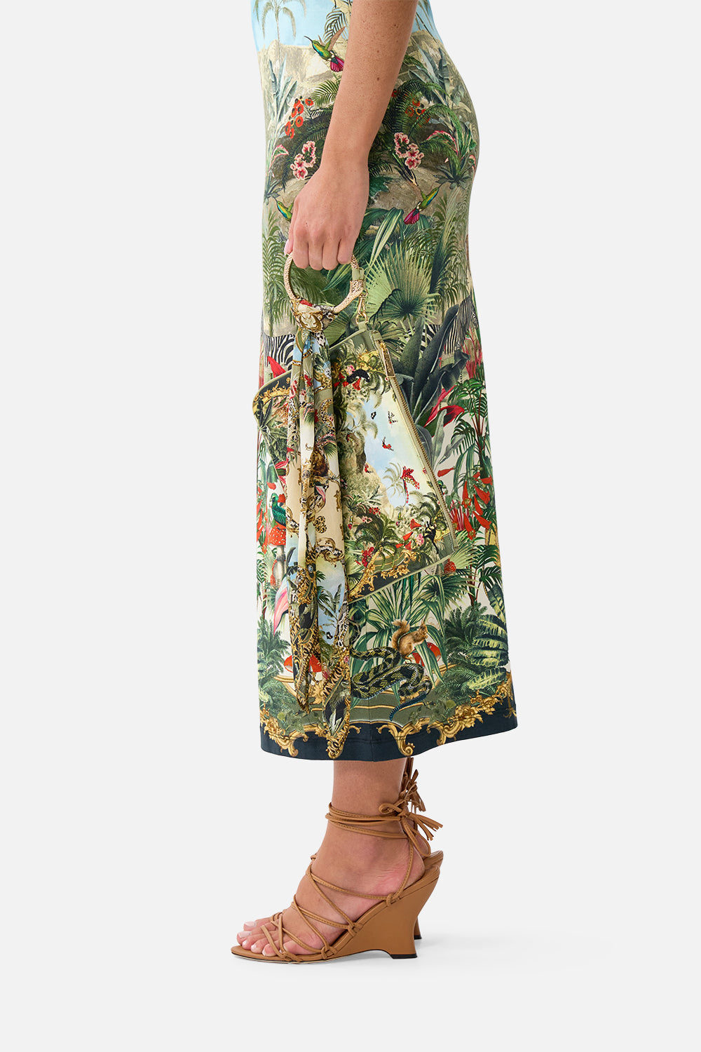 The CAMILLA Ring Scarf Clutch in our Wanderlust Empire print, side view on model.
