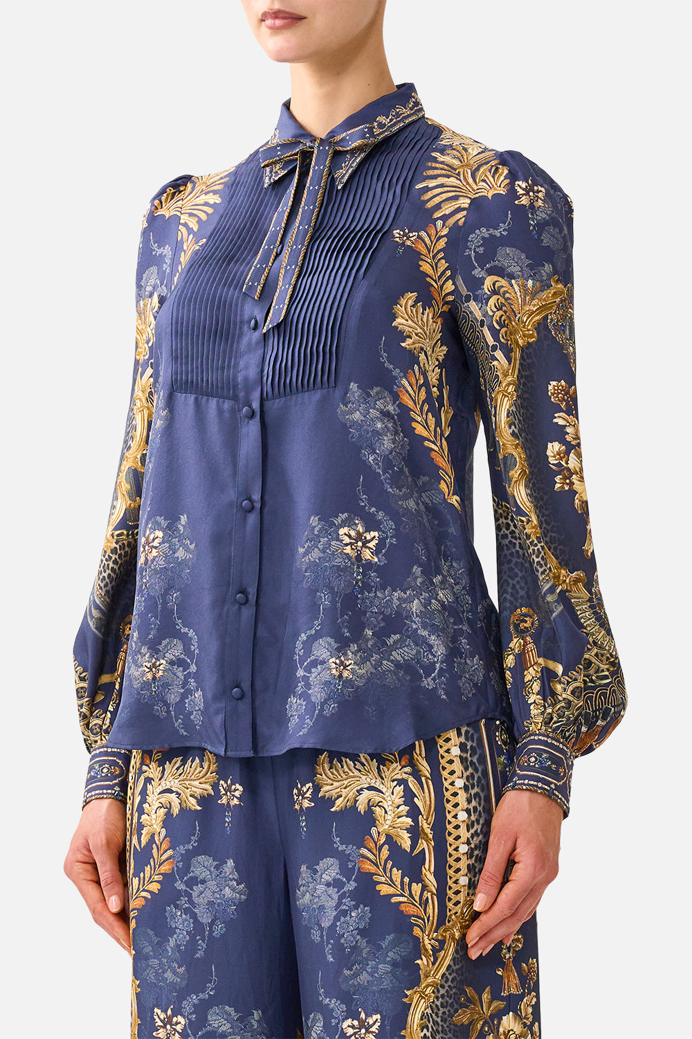 The CAMILLA Collared Shirt with Pintucks in our Cloaked in Baroque print, detail view on model.