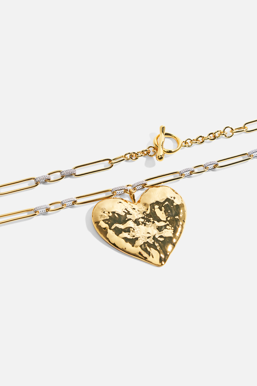The CAMILLA the heart string quintet pendant necklace in Gold. Front view.