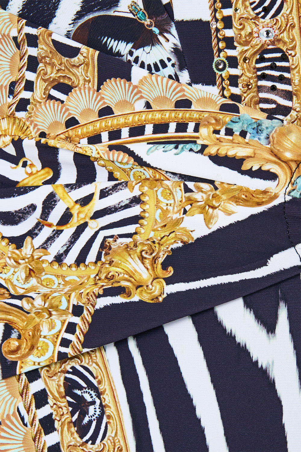 The CAMILLA Plunge Halter One Piece W Pleated Waist Trim in our Zig Zag Zoo print, fabric detail.