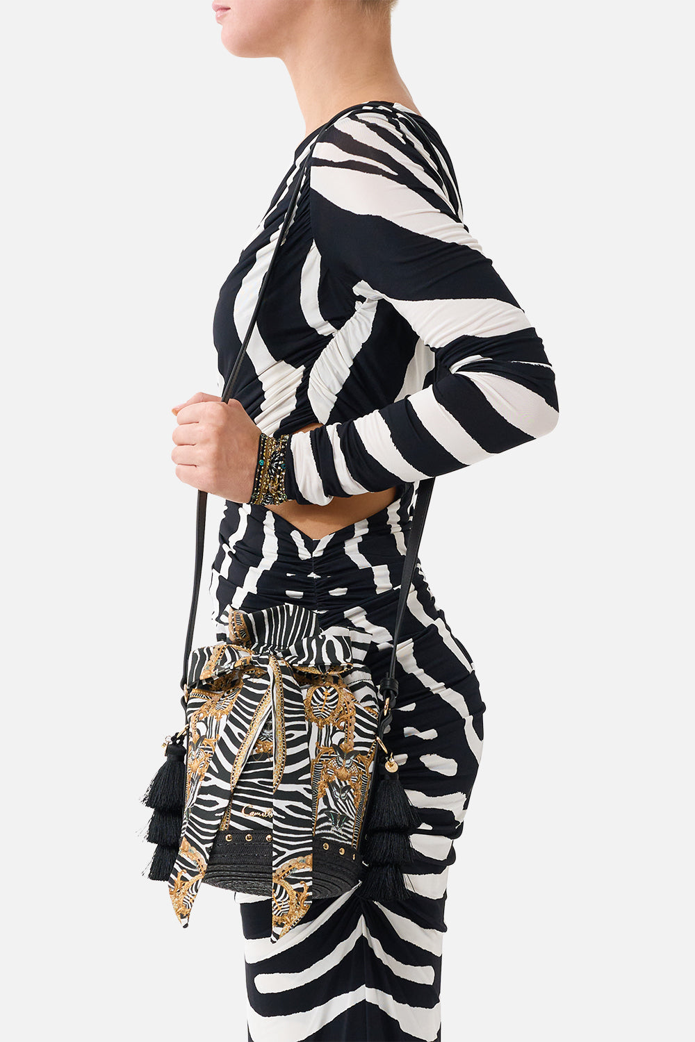 The CAMILLA Tie Top Bucket Bag With Tassels in Print Zig Zag Zoo. Model View