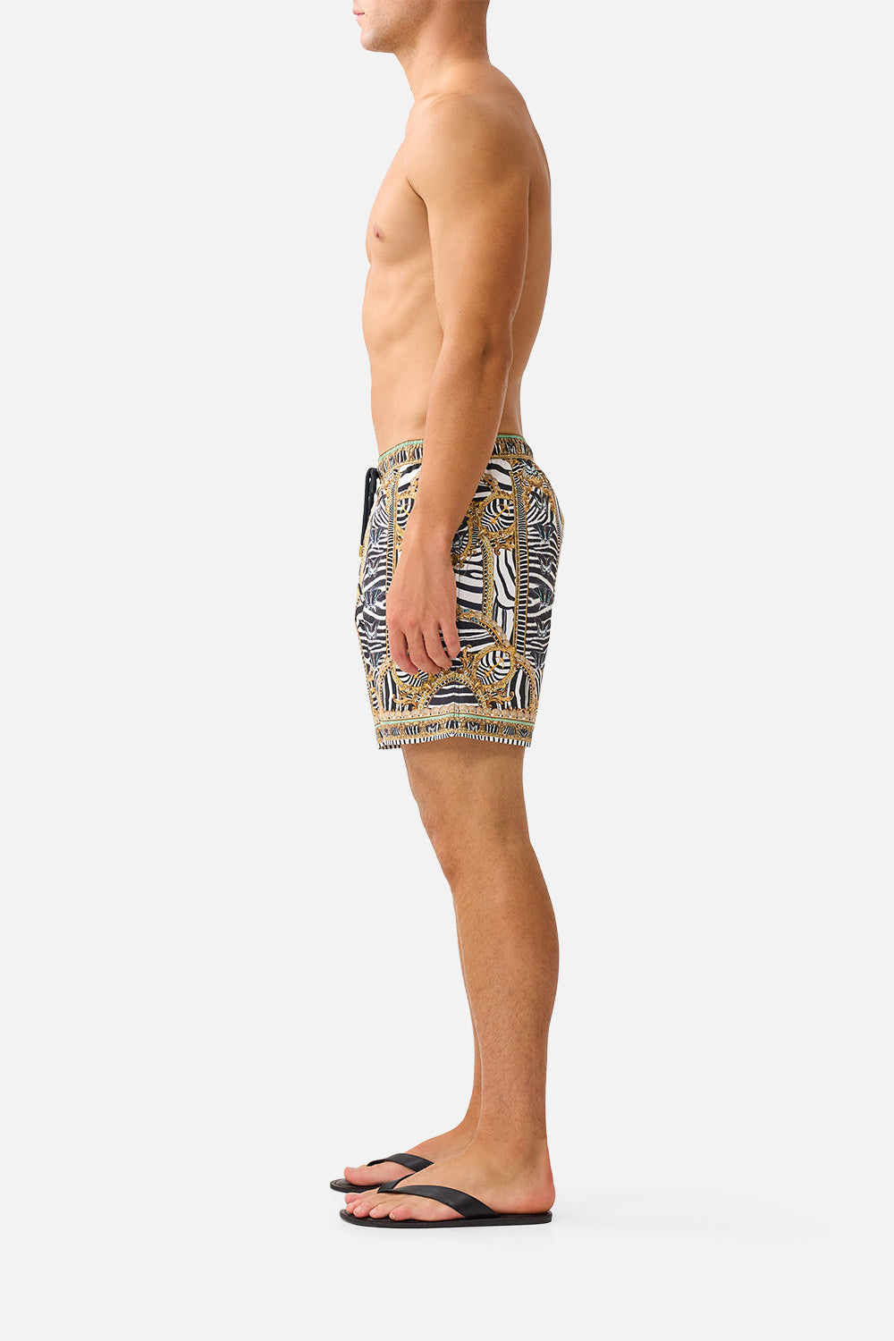 The CAMILLA Mid Length Boardshort with Elastic Waist in our Zig Zag Zoo print, side view on model.