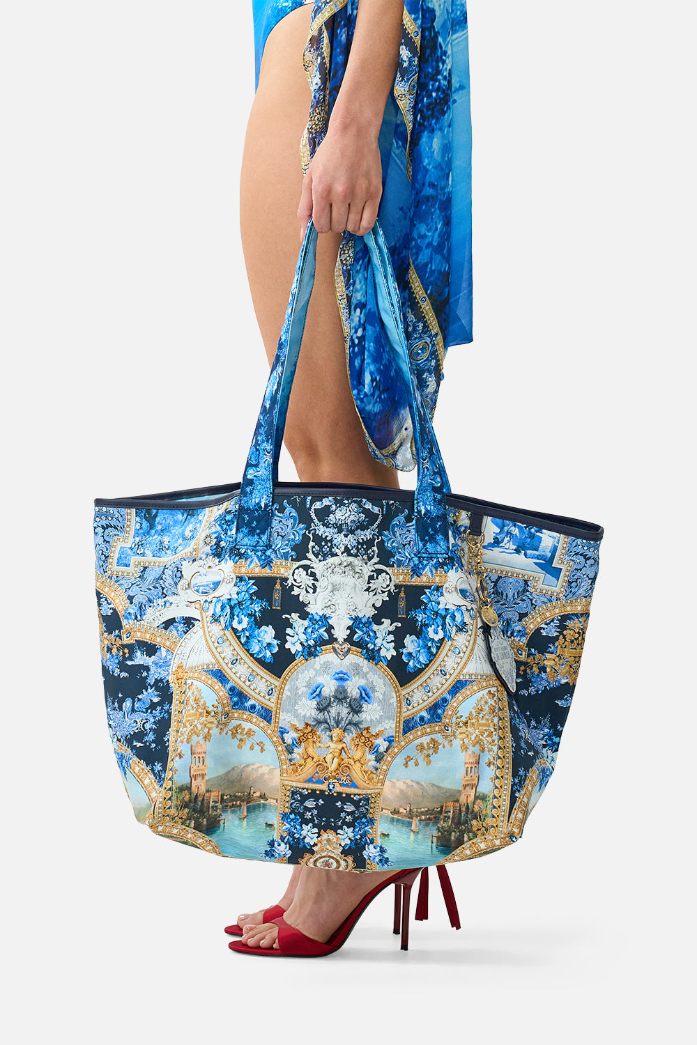 The CAMILLA Reversible Tote with Coin Purse in our Sweet Sacré Bleu print, side view on model.