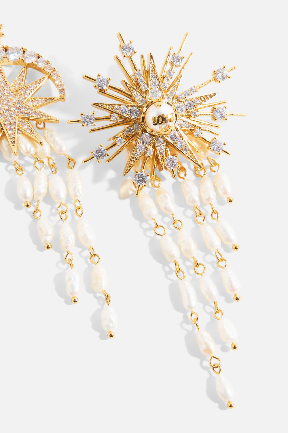 The CAMILLA Empress Of Light Star Crystal Earrings in gold.