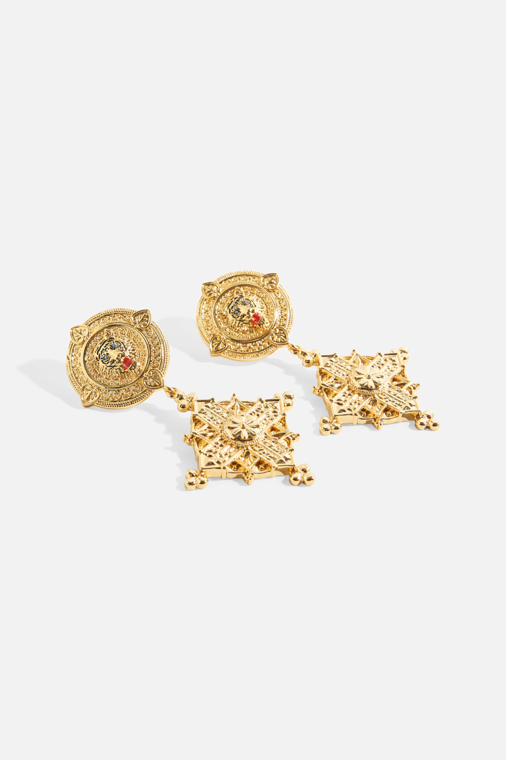 The CAMILLA Imperial Idol Pendant Earrings in gold.