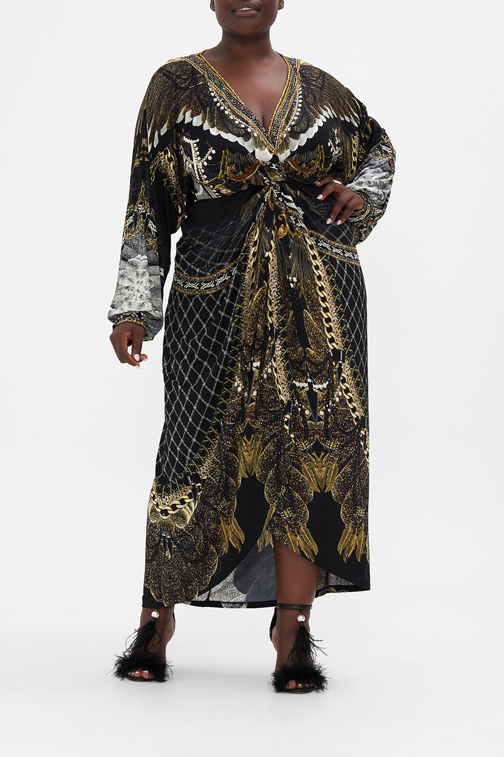 Front vie of curvy model wearing CAMILLA plus size black maxi dress in Ravin Raven print